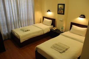 Letto o letti in una camera di Hotel Buddha Land