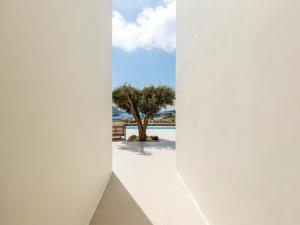 a view of the beach from the hallway of a house at Villa Venti Private Pool Retreat, Mykonos in Agios Ioannis Mykonos