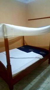 a couple of bunk beds in a room at Risa Camping Site in Kiyunga