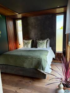 a bedroom with a large bed in a room at Isabelina Stays near Doñana & the Coast in Sanlúcar de Barrameda