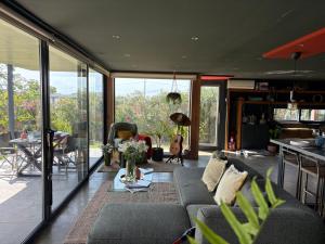 a living room with a couch and a table at Isabelina Stays near Doñana & the Coast in Sanlúcar de Barrameda