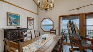 a dining room with a wooden table and chairs at Lakeside Getaway Beach Access Shared Pool and Grills in McCall +18 photos