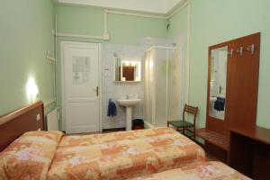 Postel nebo postele na pokoji v ubytování Hotel Barone + 37 fotografií