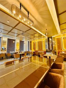a living room with a glass table and chairs at Regal Havens in Jorhat