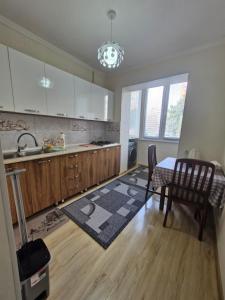 a kitchen with a table and a dining room at Rystavi in Rustavi