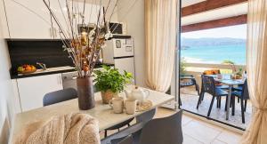 a kitchen and dining room with a view of the ocean at Residence Arinella in Farinole