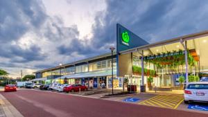 a large building with cars parked in front of it at Mariners Rest in Redland Bay