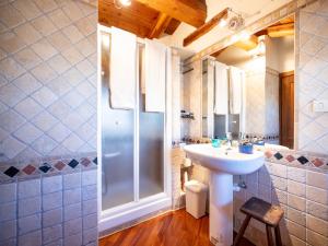 a bathroom with a sink and a shower at Meira Carlevara in San Maurizio +53 photos