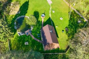 an overhead view of a house in a field of grass at Jäägri Saunamaja in Parksi