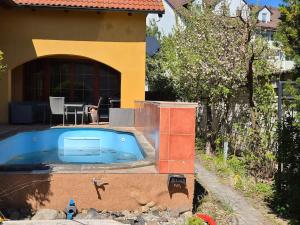 a swimming pool in the backyard of a house at Vila Rozmital in Příbram