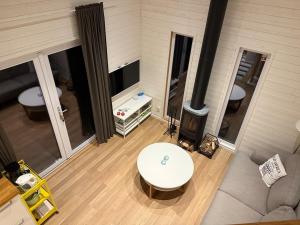 an aerial view of a living room with a fireplace at Lilla Risingegården in Risinge