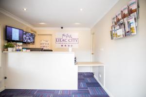 a waiting room at a clinic with a counter at Lilac City Motor Inn & Steakhouse in Goulburn