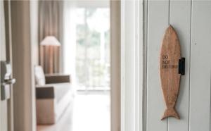 a wooden door knob with a do not disturb sign on it at Marina Express-Fisherman Aonang in Ao Nang Beach +16 photos