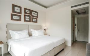 a white bedroom with a large white bed at Marina Express-Fisherman Aonang in Ao Nang Beach