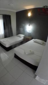 TEBiNG Guest House Taman Negara Malaysia Kuala Tahan客房内的一张或多张床位