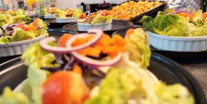 a bunch of plates of food on a buffet at ZAYON - Villa AB Anziz in Pamandzi