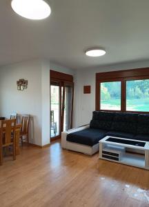 a living room with a couch and a table at Casa Agarimo in Arcade