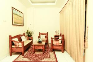 Χώρος καθιστικού στο Griya Langen Guesthouse