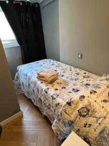 a bedroom with a bed with a comforter on it at Casa Lanza in Chioggia