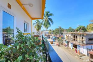 a balcony with a view of a street at VaoVao Hotel in Nosy Be