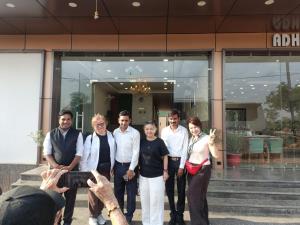 a group of people standing in front of a building at Aadhya Hotel & Adhira Restaurant in Orchha
