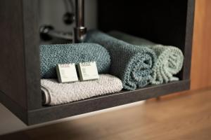 a shelf with towels and towels on it at Gästehaus Kaufmann in Mellau +79 photos