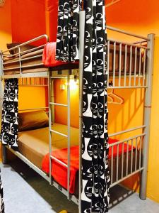 a bunk bed room with two bunk beds in a room at CSW Hostel in Singapore