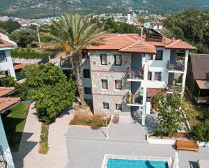 an aerial view of a house with a swimming pool at Köseoğlu Apart Villa in Fethiye