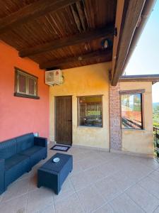 a living room with a couch and a table at Casa Vacanze Panoramika Santa Cruz - Appartamento PANORAMIKA in Cicerale