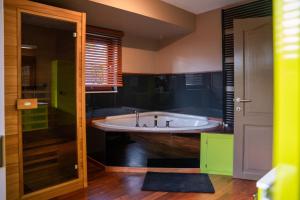 a large bathroom with a tub and a window at Rouges Terres in Theux +32 photos