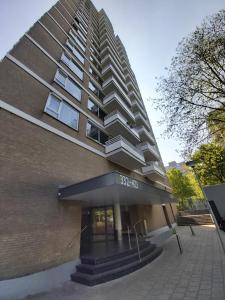 a tall building with a balcony on top of it at sky home room 2 in Amsterdam