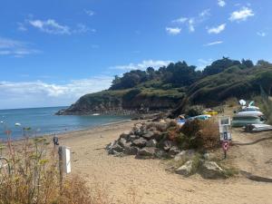 a beach with a bunch of boats parked on it at Maison, atypique, proche, mer in Plérin