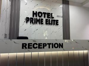 a hotel prime line reception sign in a room at Hotel Prime Elite in Ahmedabad