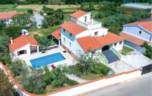 an aerial view of a house with a swimming pool at Stunning Home In Peruski in Peruški +49 photos