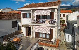 an aerial view of a house with a balcony at Cozy Apartment In Jadranovo in Jadranovo