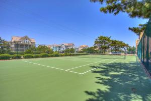a tennis court in front of some houses at QCB5 - Saltaire Sunrise in Nags Head