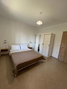 a bedroom with a large bed in a room at Athanasia's Eremion in Zagora