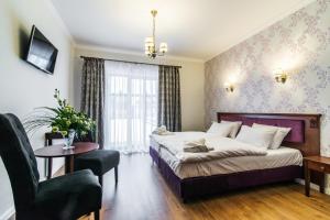 Łóżko lub łóżka w pokoju w obiekcie Pałac Margot Nature&SPA