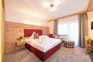 Ένα ή περισσότερα κρεβάτια σε δωμάτιο στο Hotel Garni Schellenberg