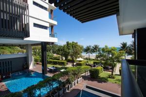a view from the balcony of a building with a swimming pool at Escape Condominium By A property in Mae Pim