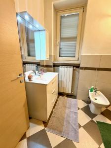 a bathroom with a sink and a toilet at Dimora del Centro in Acqui Terme +13 photos