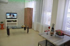 Et tv og/eller underholdning på Isramax Jerusalem Apartment in Bat-Yam