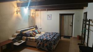 a small bedroom with a bed in a room at Enchanting woods Yercaud in Yercaud