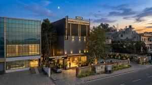 a building on a city street with a building at Yashobhoomi Hotel Grand Tashree in New Delhi