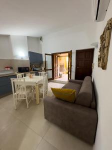 a living room with a couch and a table at La casina di Sara in Cavo