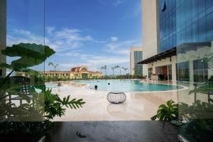 a pool in the middle of a building at Khách Sạn The Grand Dragon in Móng Cái