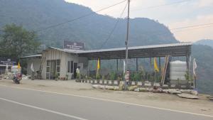 a gas station on the side of the road at Deep Heritage Hotel & Restaurant in Phata