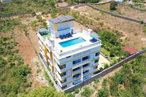 an aerial view of a house with a swimming pool at Casa Marabella C3 in Diani Beach