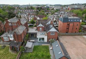 an aerial view of a city with houses at 4 Spicer Road in Exeter