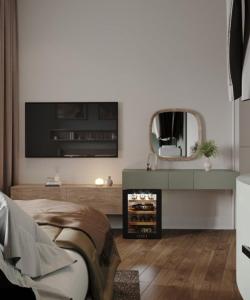 a living room with a tv and a mirror at Aureline Hill in Baku